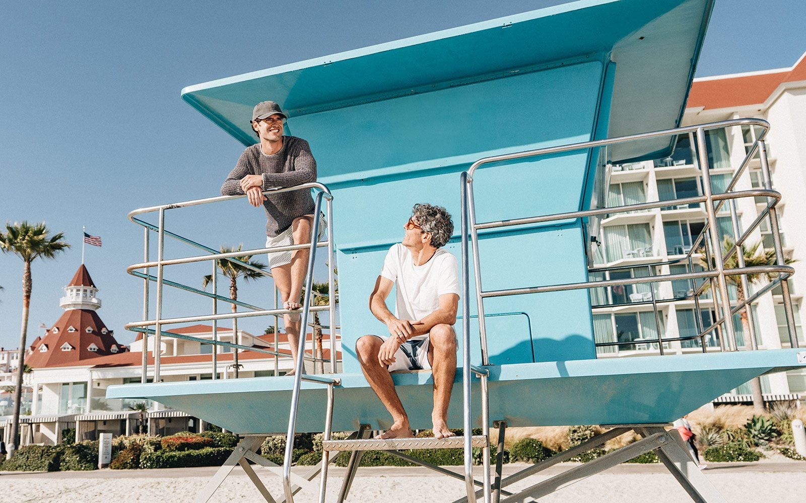 Two men on a lifeguard tower