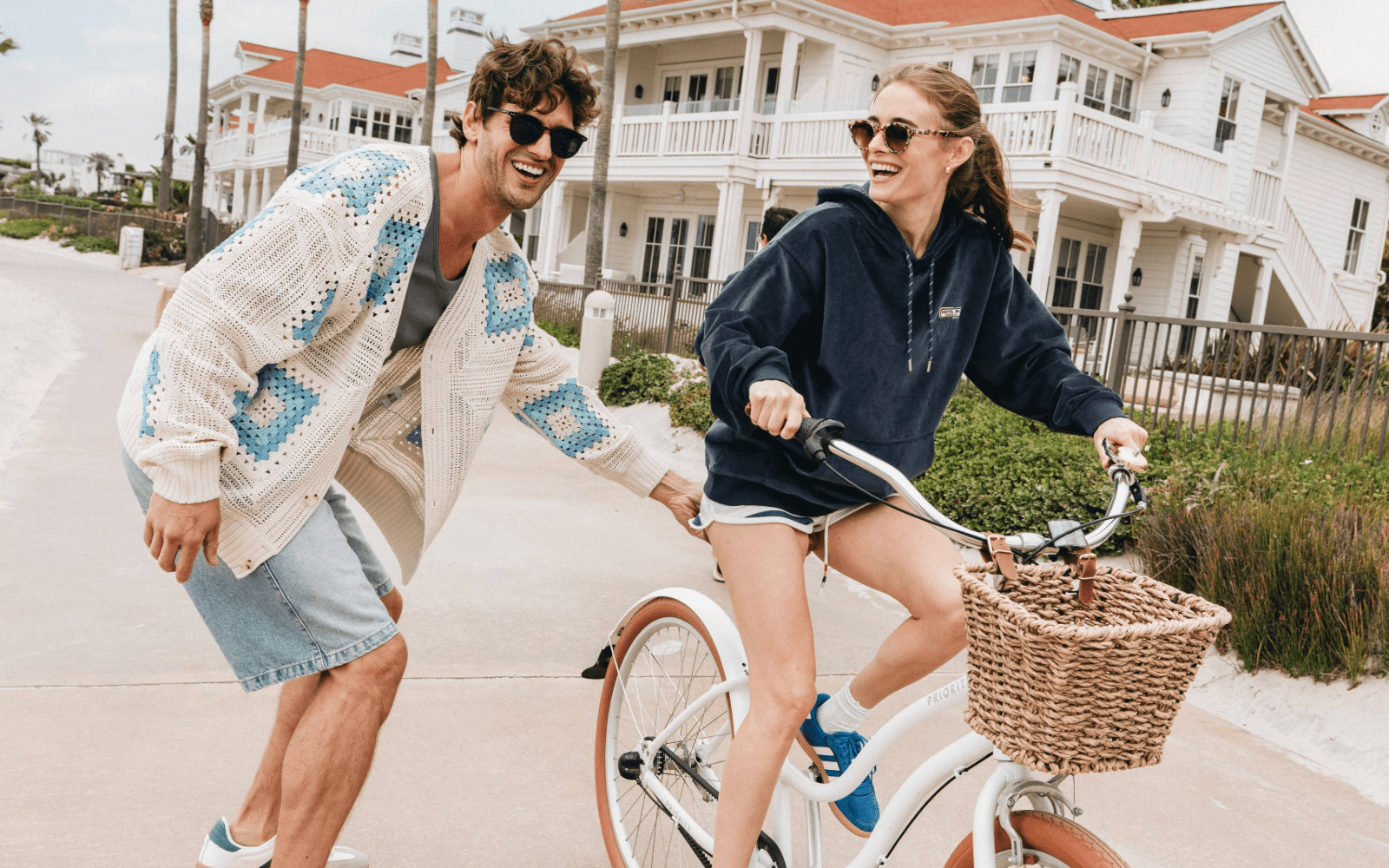 couple biking on the boardwalk