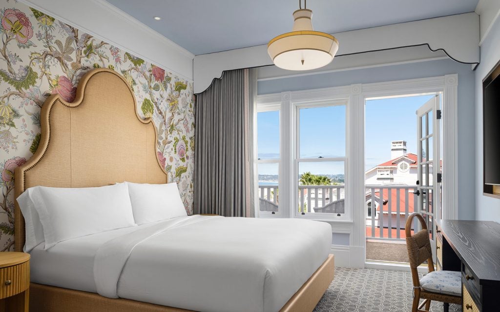 Oceanview Victorian guest room with king bed and balcony
