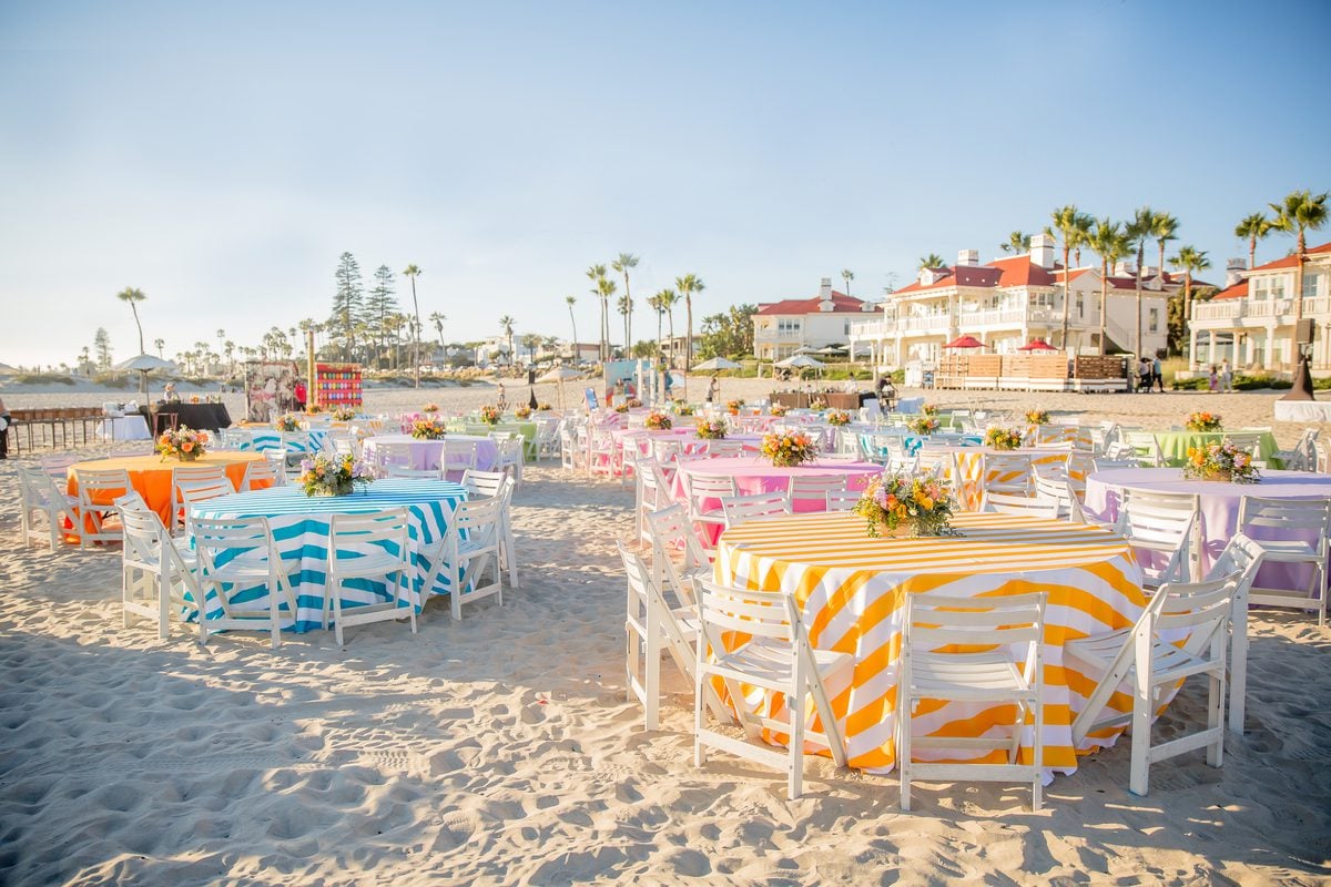 Event set-up with colorful tablecloths on the beach